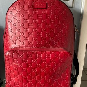 GUCCI
Red Guccissima Leather Signature Backpack ( used ) embossed leather